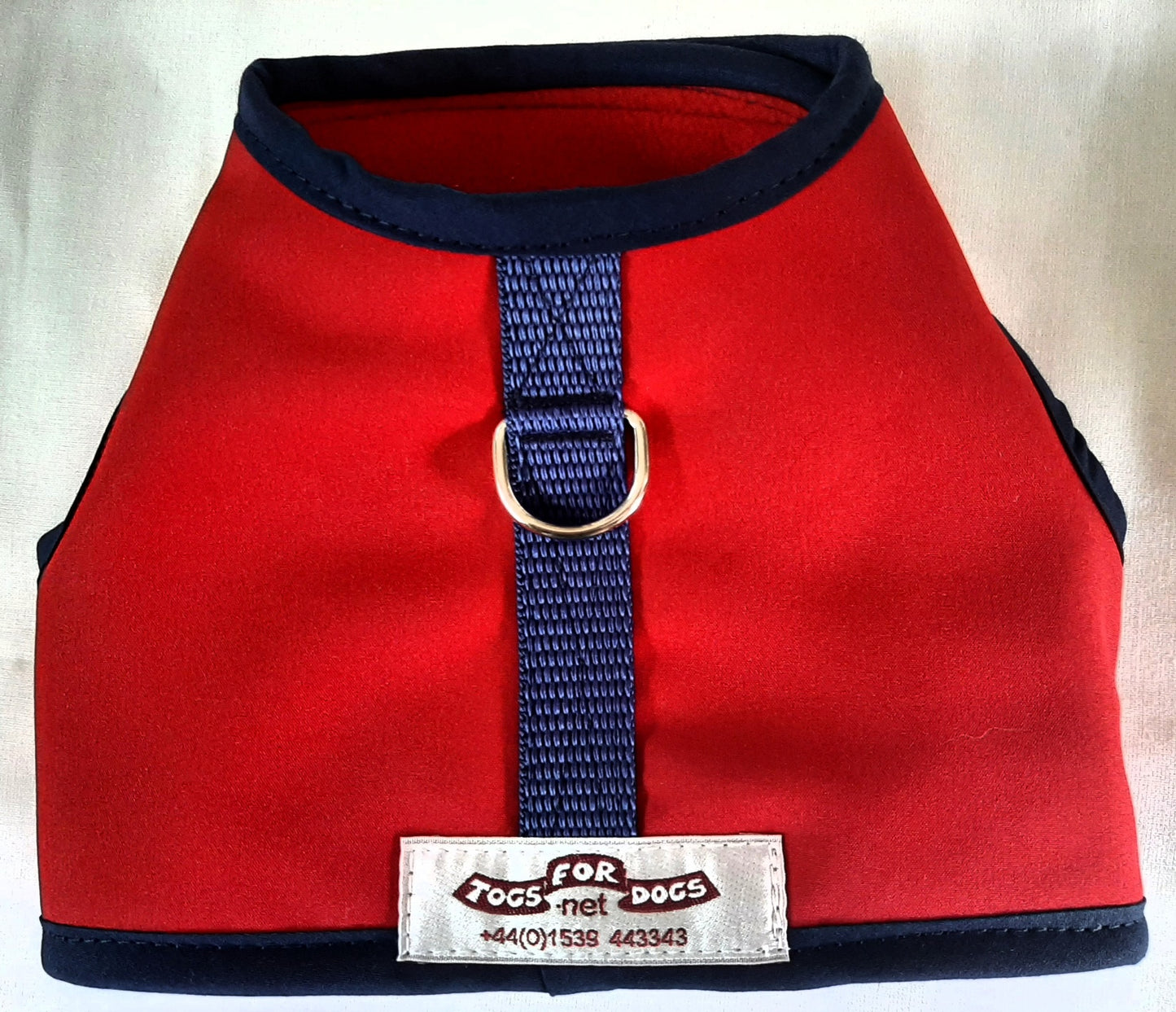 Red Softshell harness, water & wind resistant with warm fleece lining.